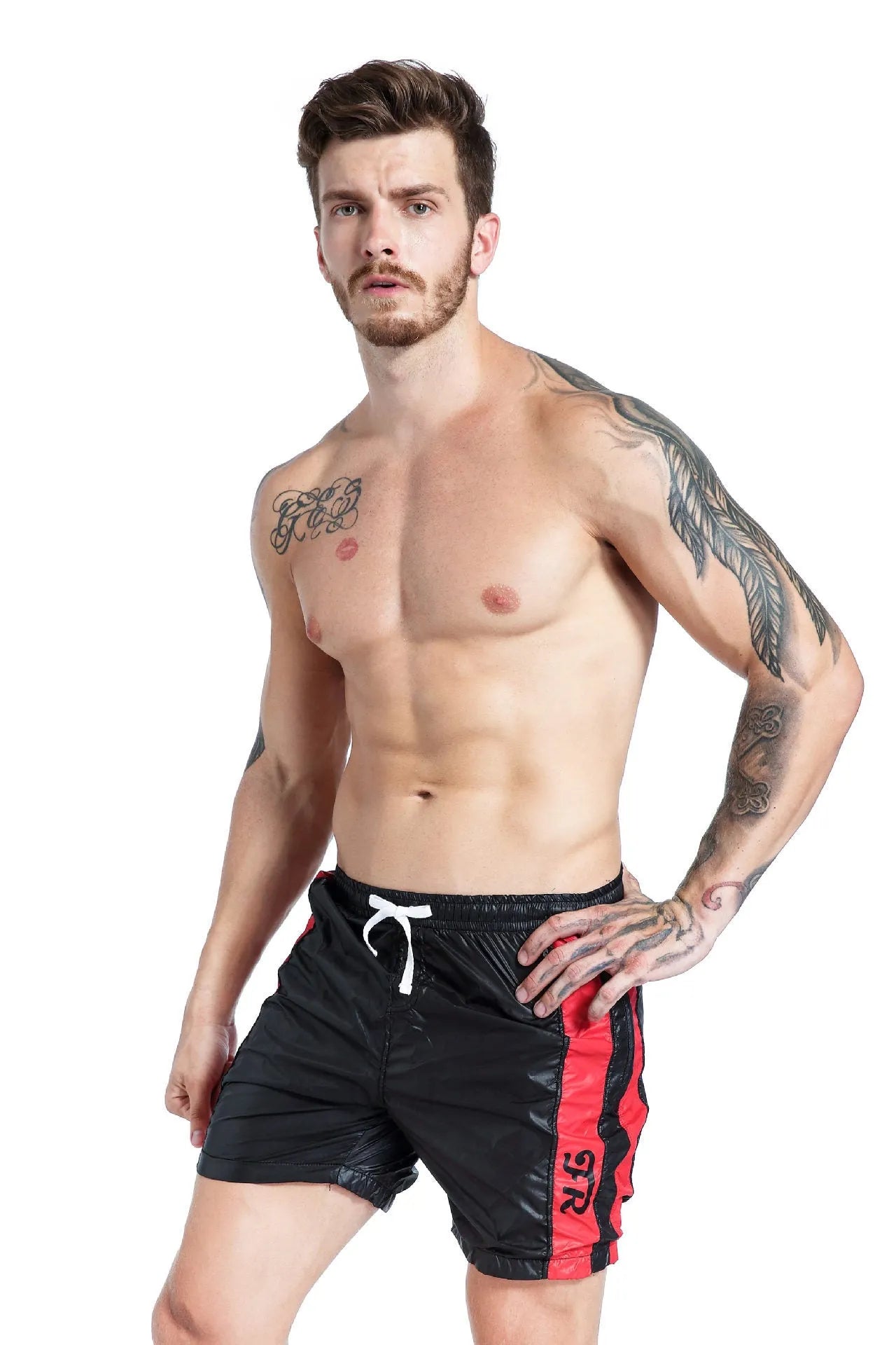 Blue men's slim fit polyester sports shorts with padding and a lace-up waistband on a white background.
