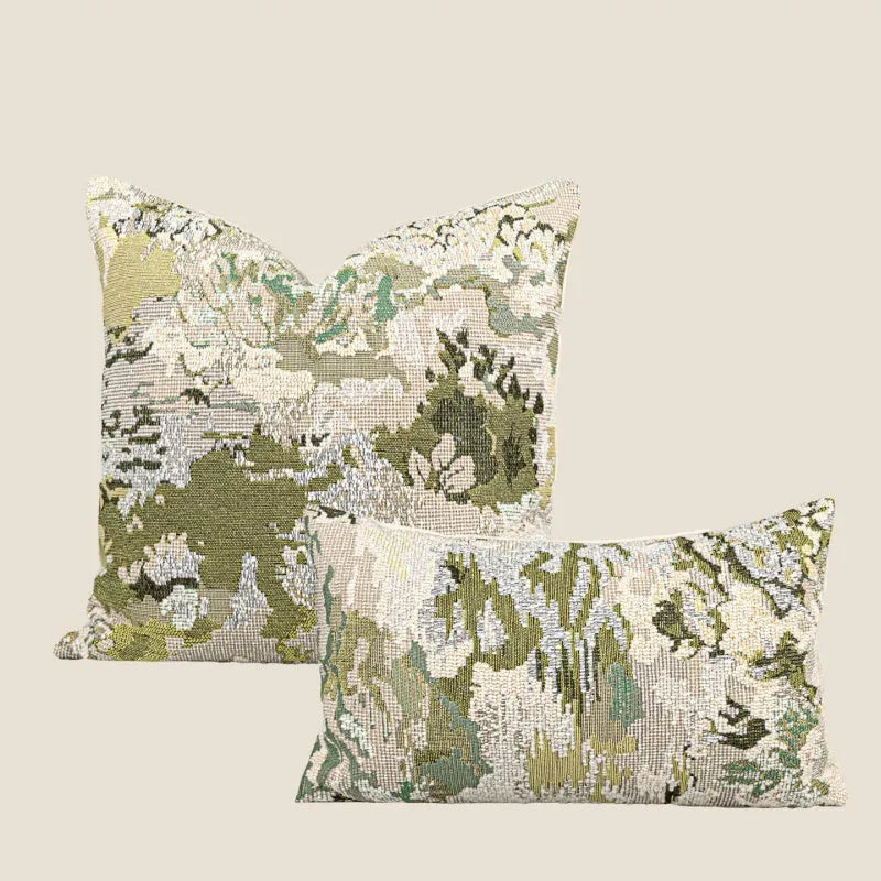 Antique green wool blend decorative pillow with abstract floral pattern, shown in lumbar and square sizes.