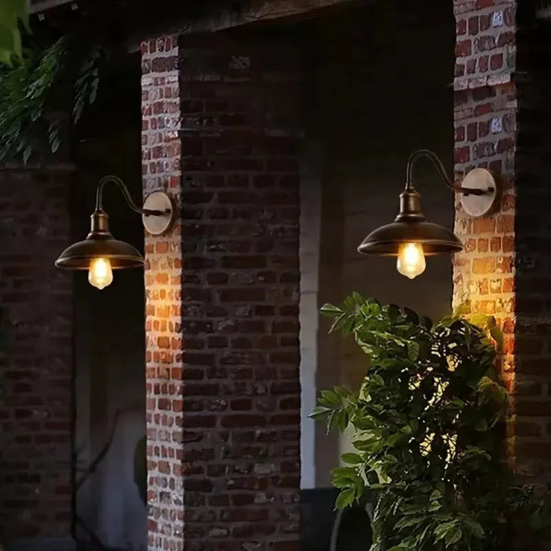 Retro-style outdoor wall lamp for a villa courtyard, shown in copper and silver finish options.