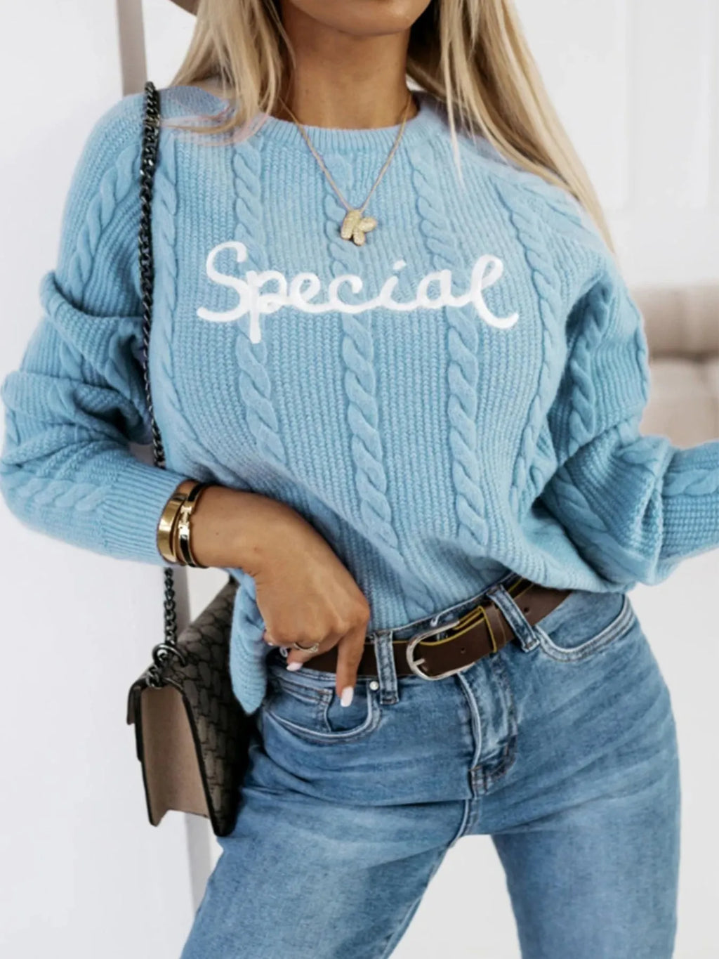Blue crew neck knitwear pullover with embroidered letters in street fashion style