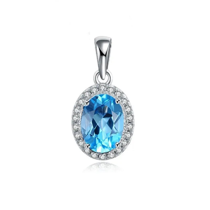 925 sterling silver jewellery set with blue topaz gems showing earrings, ring, pendant and necklace with geometric design