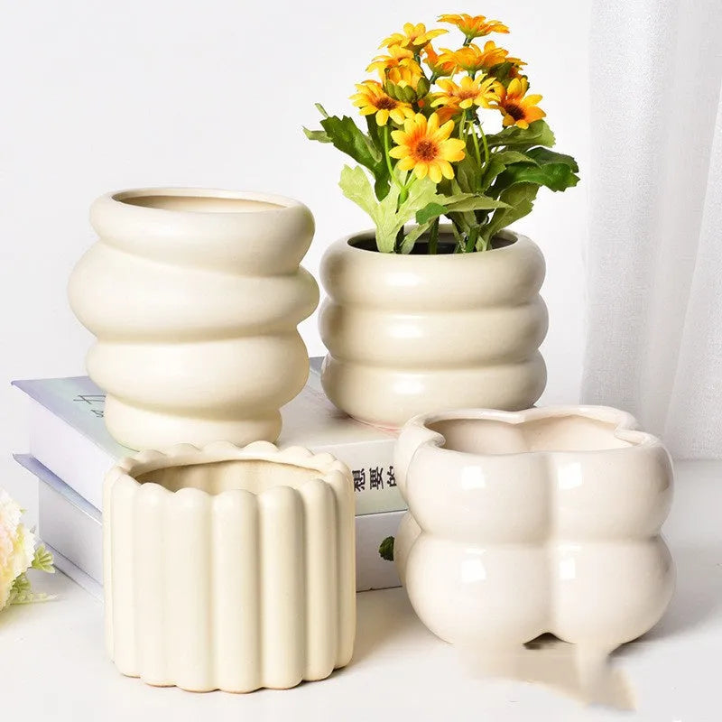 Roman column style matte yellow ceramic flowerpot for home plant decoration.