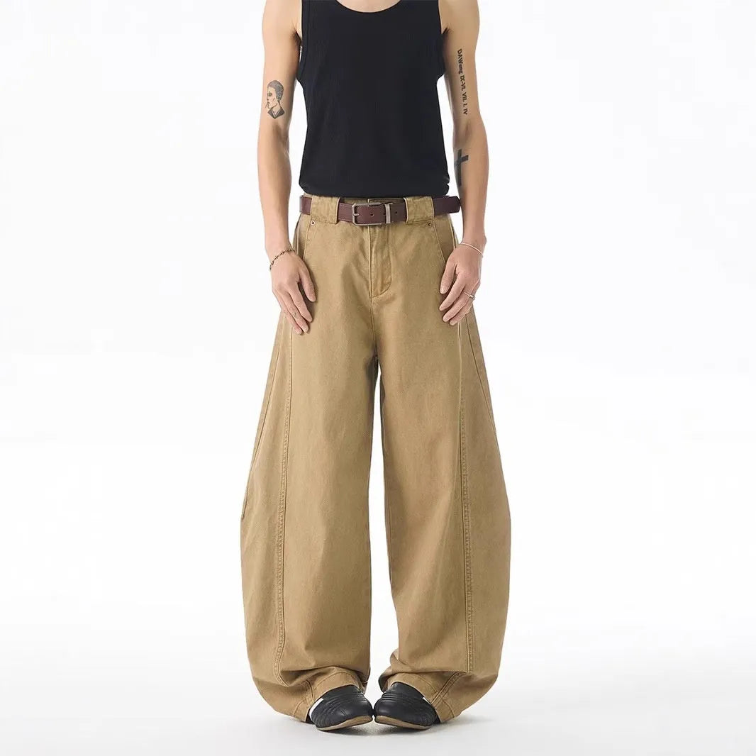 Men's brown loose fit denim jeans with straight leg and button fly