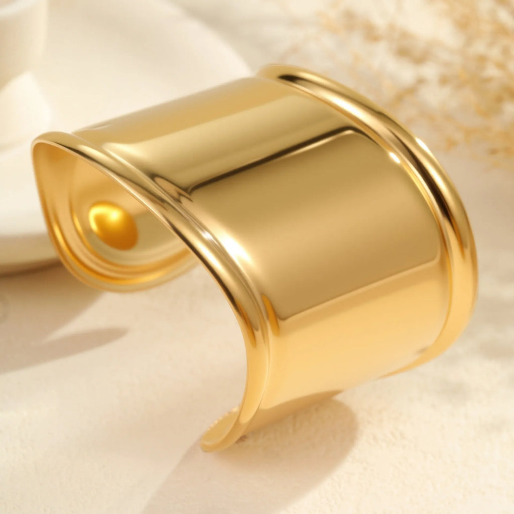 Women's stainless steel bracelet with geometric wave design and gold plating