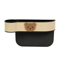 Leather car seat gap storage box with cartoon bear design for organising phones and keys.