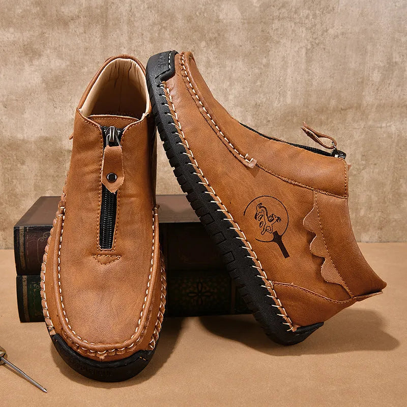 Men's black slip-on casual loafers with round toe and rubber sole.