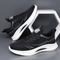 Men's black fly woven mesh casual shoes with round toe and rubber sole on a white background.