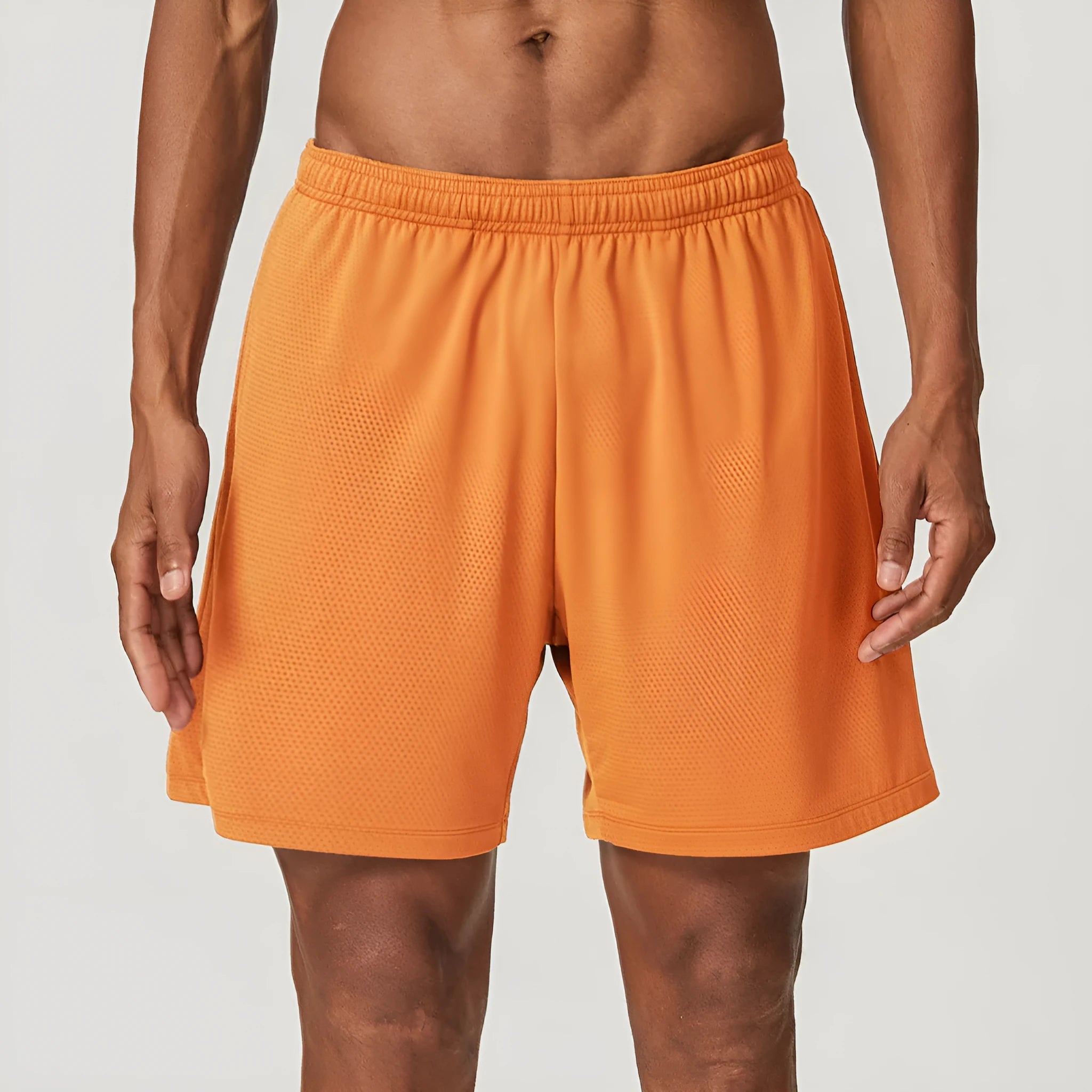 Men's quick-drying double-layer running shorts in khaki colour, showing mid-waist fit and shorts length.