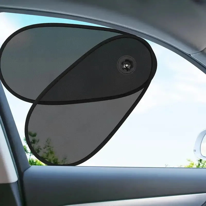 Black adjustable car window shade with suction cups stretched across vehicle side window
