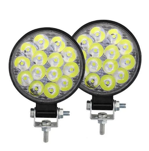 White mini round 42W LED work light with aluminium housing for vehicle mounting.