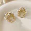Gold-coloured copper flower basket earrings with pearl inlay and small rice-shaped bead detailing