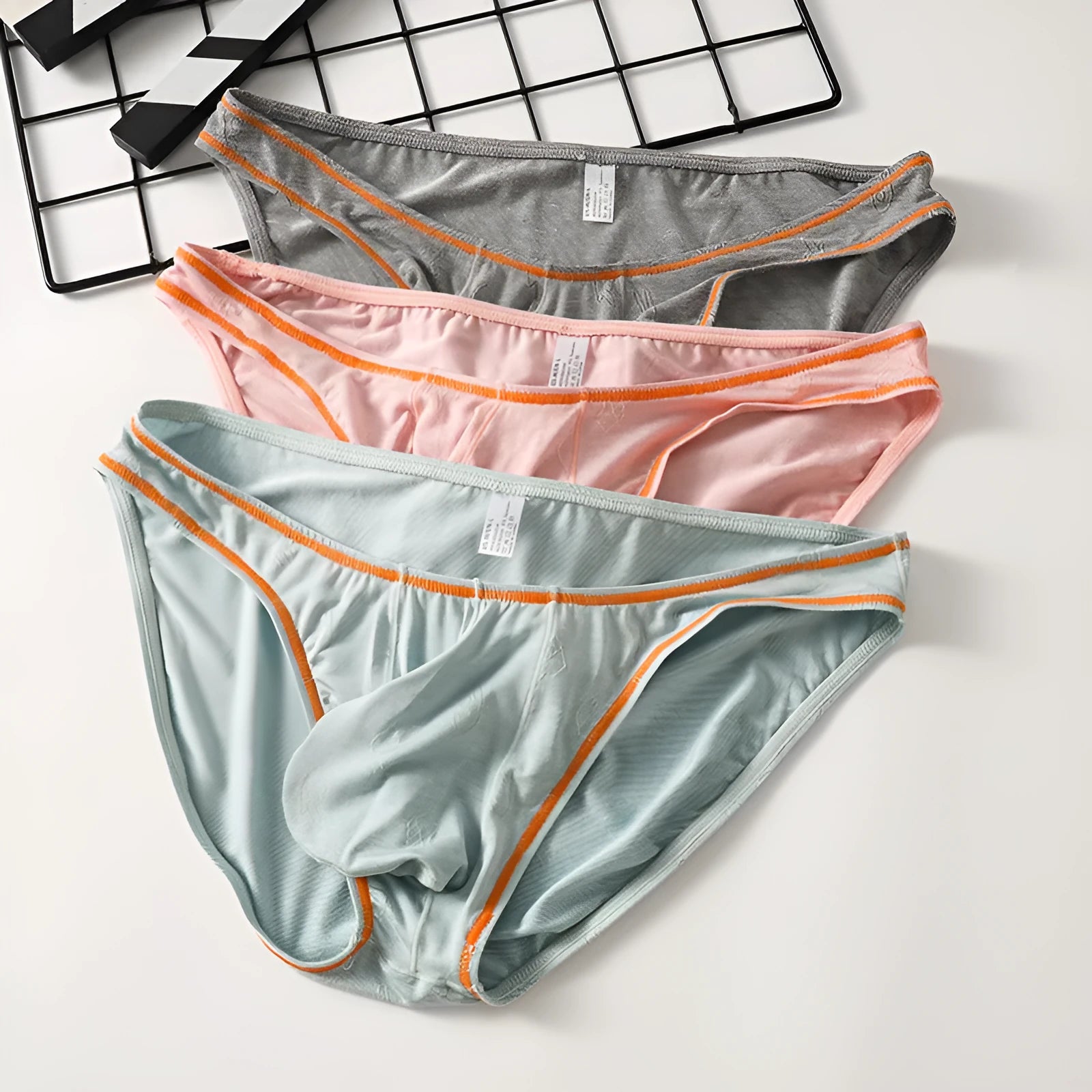 Men's dark grey modal hip-lift boxer shorts laid flat, showing knitted fabric texture.