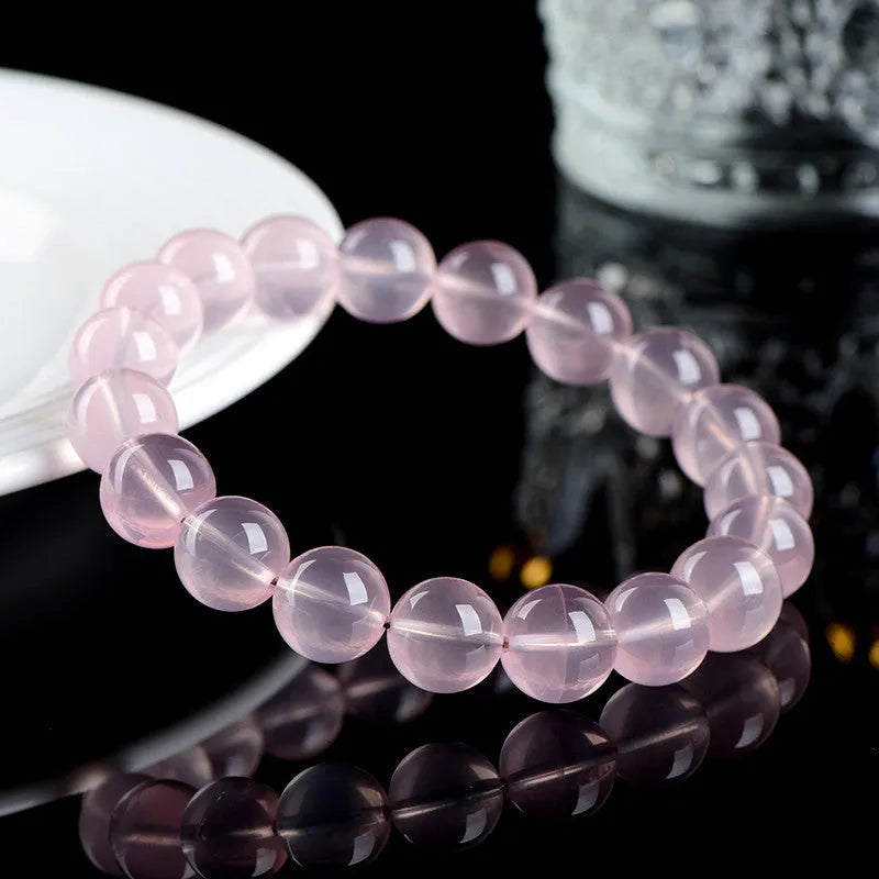 Natural starlight crystal round bead bracelet in pink with polished finish