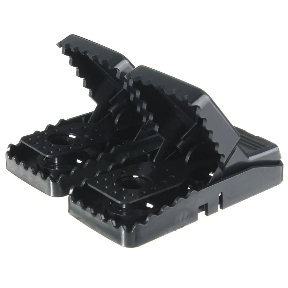 Six black plastic snapping mousetraps showing 11cm length and biting mechanism