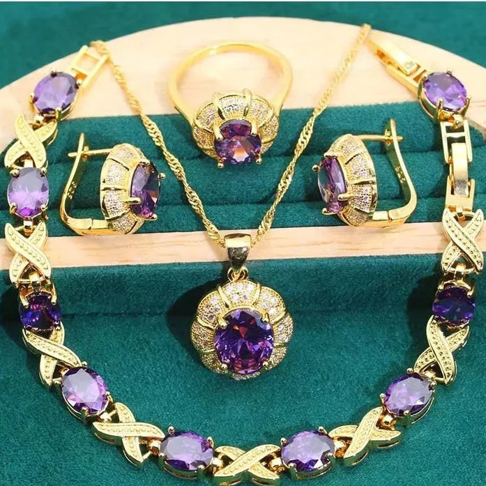 18k gold plated jewellery set with ring, earrings, bracelet and necklace featuring coloured zircon stones.