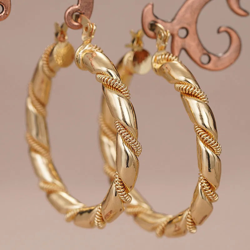 Geometric women's earrings with ring ear clip design in golden copper material