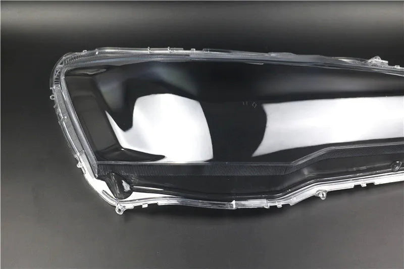 Transparent plastic headlight housing cover measuring 50x30x20mm for vehicle lampshade protection