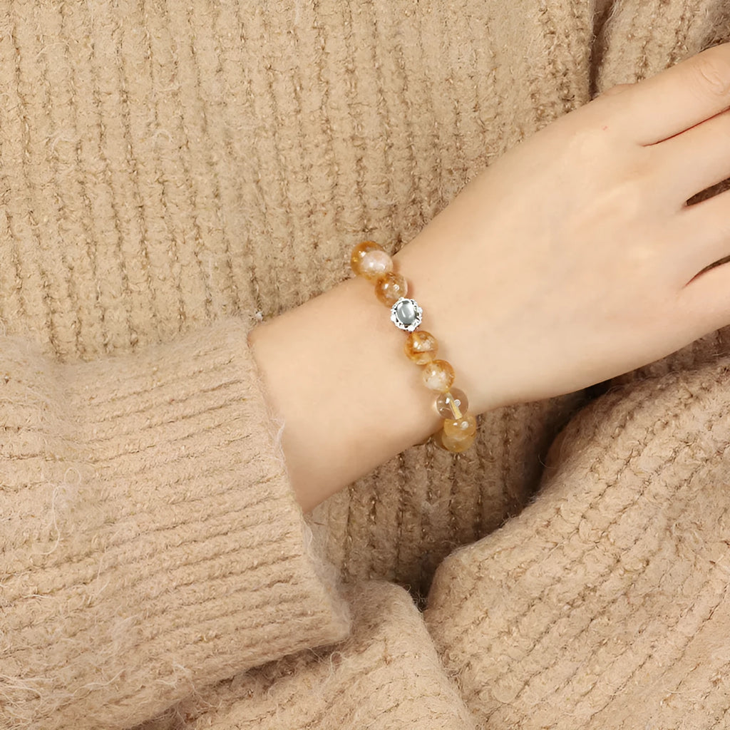 Citrine crystal bracelet with 10mm geometric faceted beads on wrist