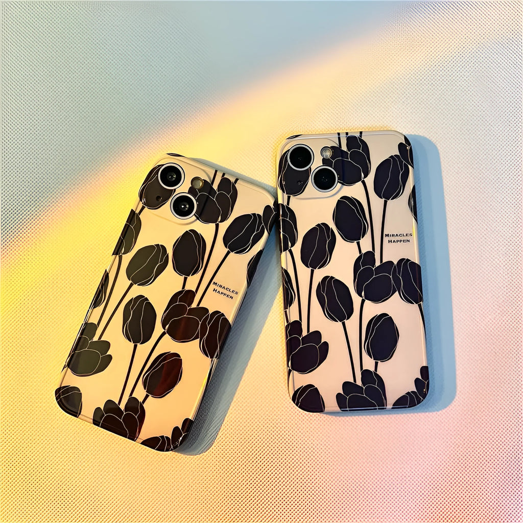 Black silicone iPhone case with a large tulip flower design on the back.