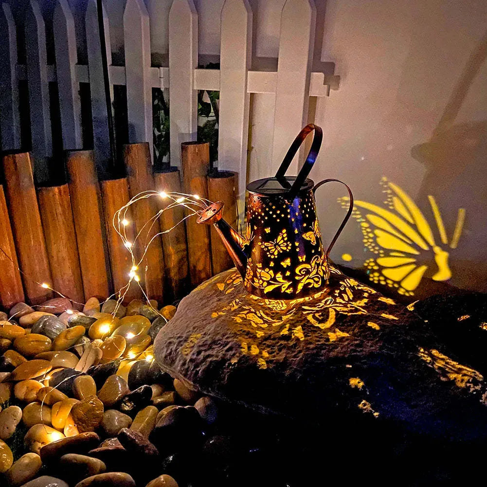 Tapered butterfly pattern iron solar garden lamp with warm white LED lighting