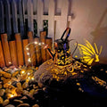 Tapered butterfly pattern iron solar garden lamp with warm white LED lighting