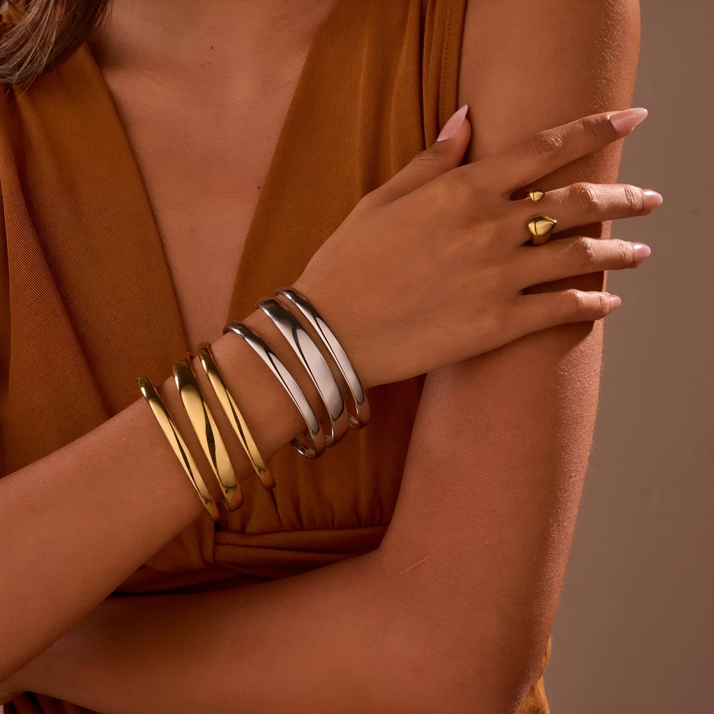 Gold electroplated stainless steel geometric line bracelet for women with a simple clasp.
