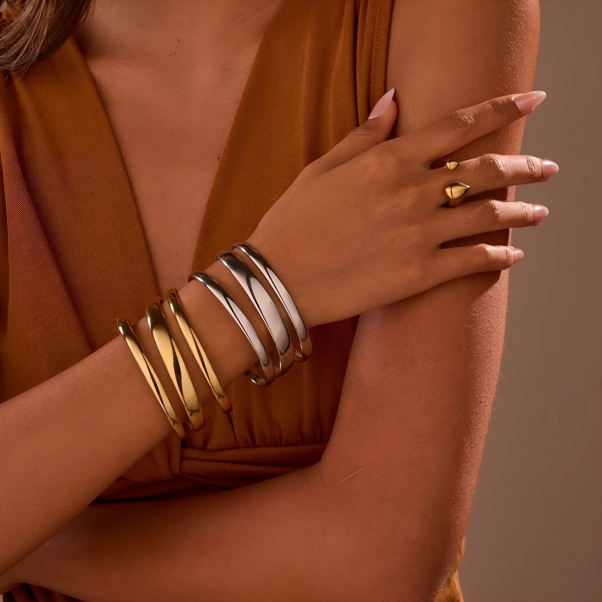 Gold electroplated stainless steel geometric line bracelet for women with a simple clasp.
