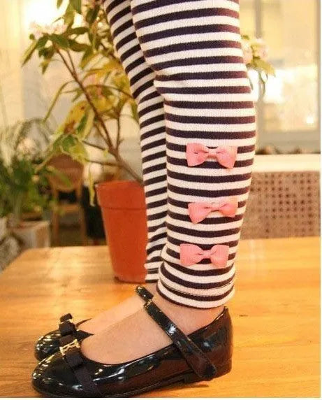 Pink cotton two-piece clothing set for a young girl, showing top and bottom.