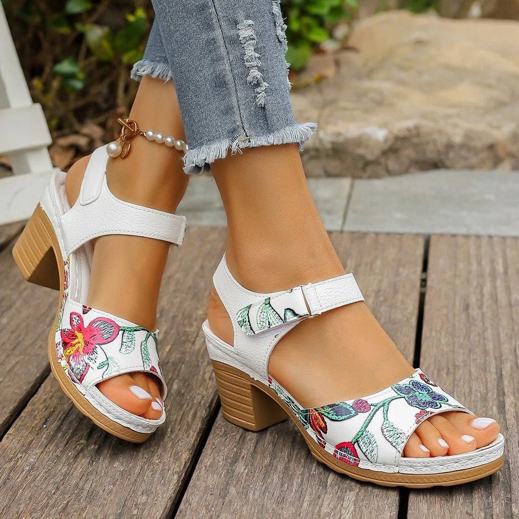 White women's high heel casual sandals with a visible Velcro strap buckle on the instep.