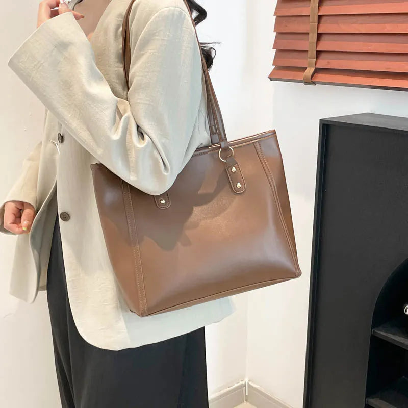 Korean style horizontal square shoulder underarm bag in PU material with a sandwich pocket.
