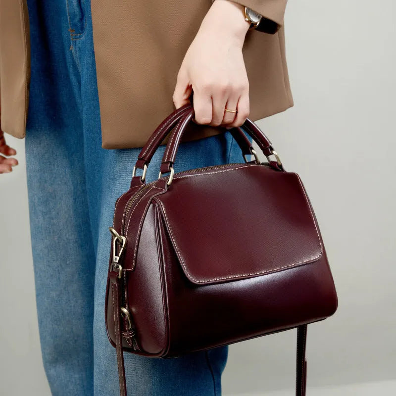 Women's soft genuine leather crossbody tote bag in a cross square shape with double straps.