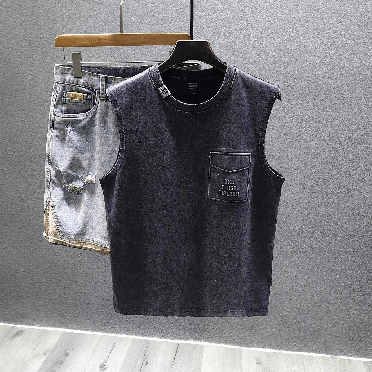 Men's solid colour loose fit cotton sleeveless t-shirt on a hanger