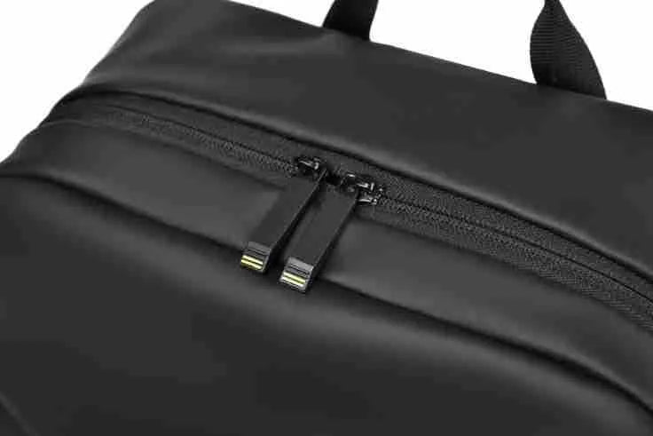 Waterproof large capacity black PU backpack with sewing thread detailing, shown closed.