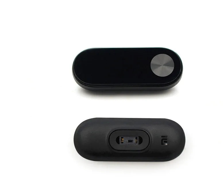 Black Xiaomi Mi Band 2 fitness tracker with OLED screen on a wrist.