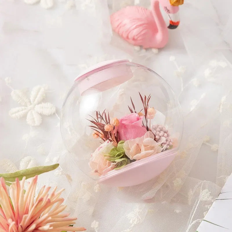 Pink preserved rose ornament in a gift box with optional bluetooth base and international plugs