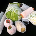 White foam fruit protection nets showing different sizes for apples, pears and peaches