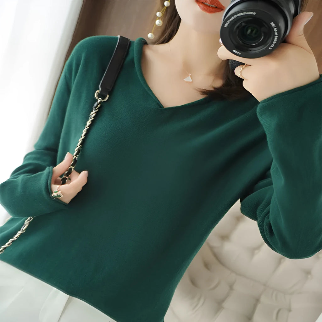Women's V-neck long sleeve knitwear top in wine red colour, laid flat.