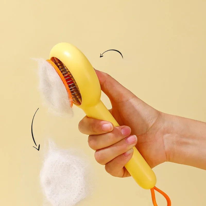 Small yellow duck-shaped pet grooming comb with stainless steel needles