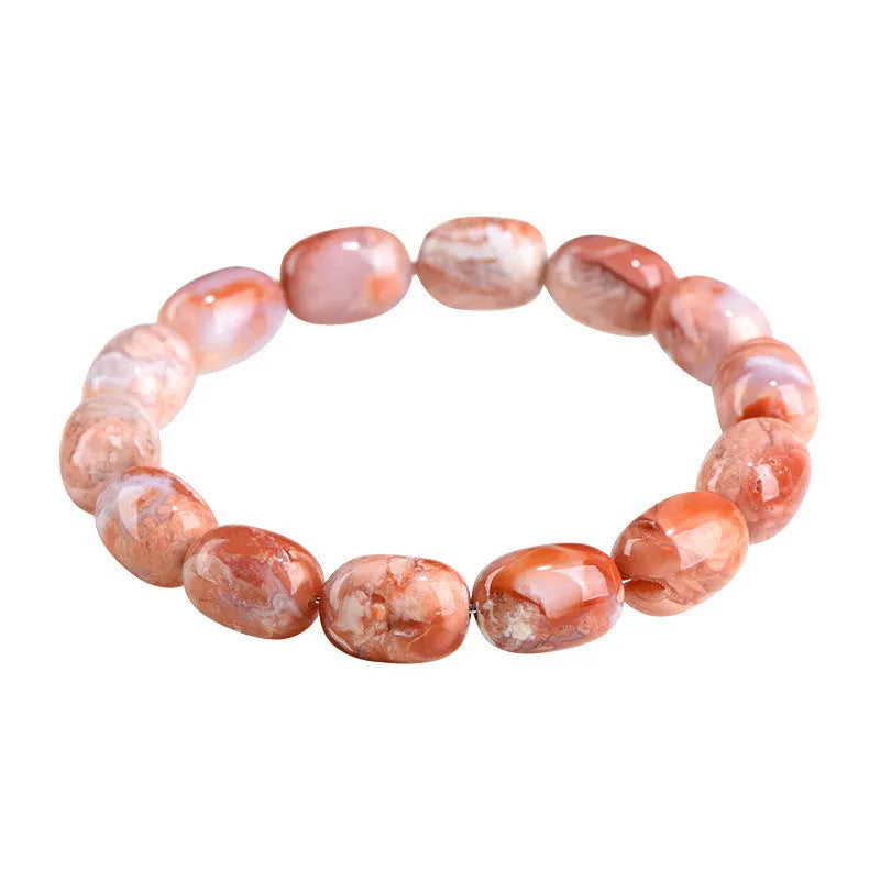 Natural cherry agate barrel bead bracelet with Ruyi design elements on wrist