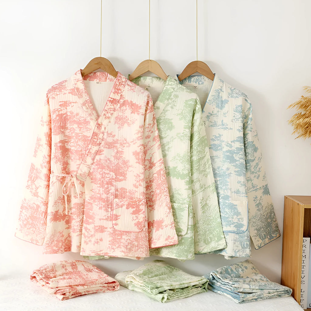 Women's pink cotton gauze lounge suit two-piece set with lace-up front trousers detail.