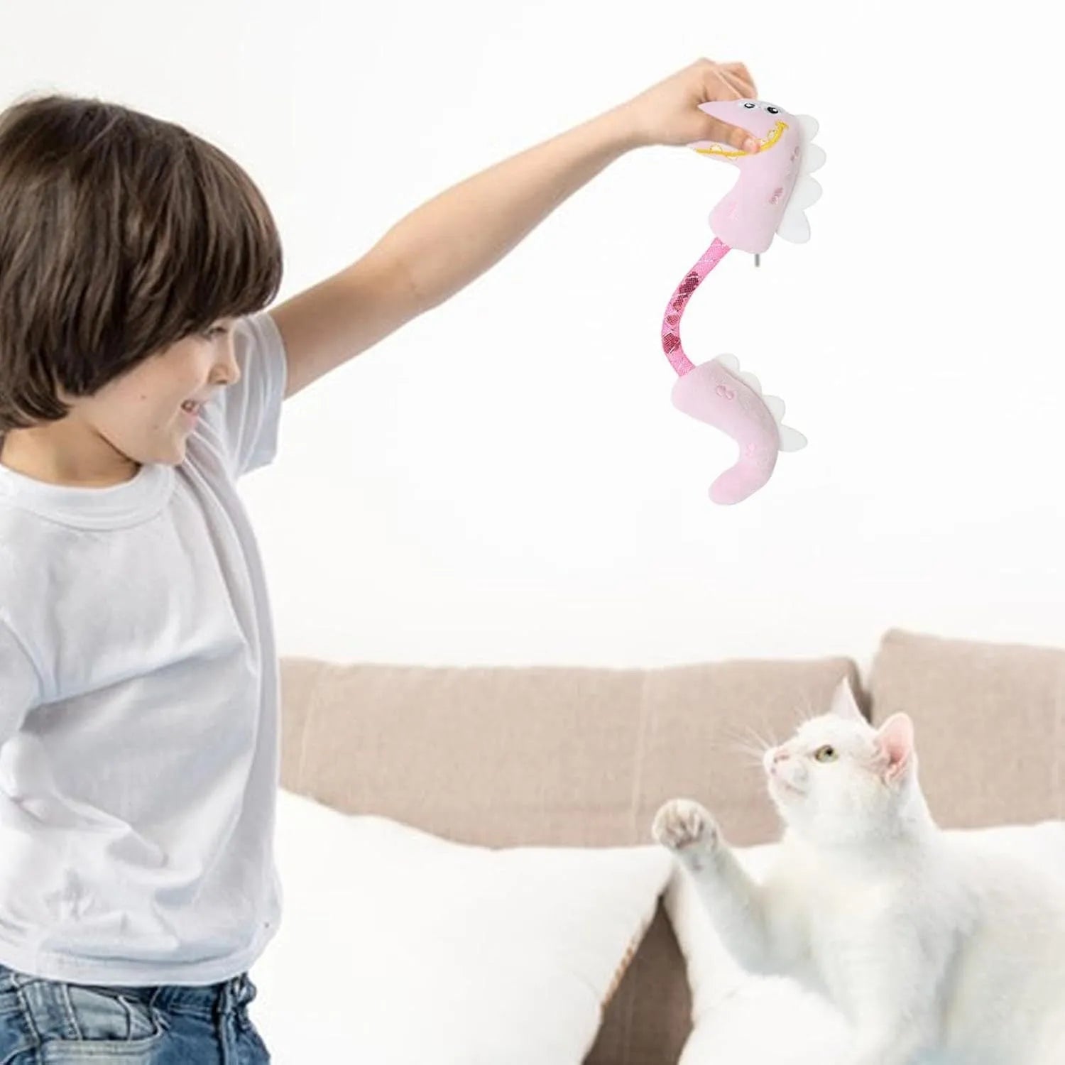 Assortment of cat toys including chew toys, rope toys, springs, and kicker toys in pink, purple and yellow
