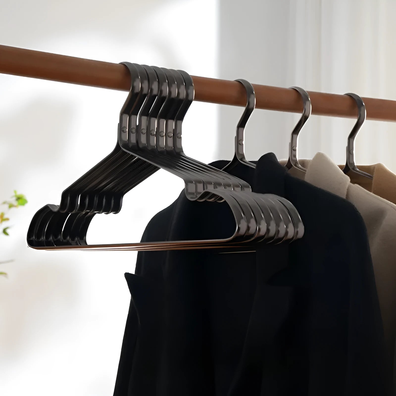Elegant black modern simplicity clothes hanger with anti-slip surface.