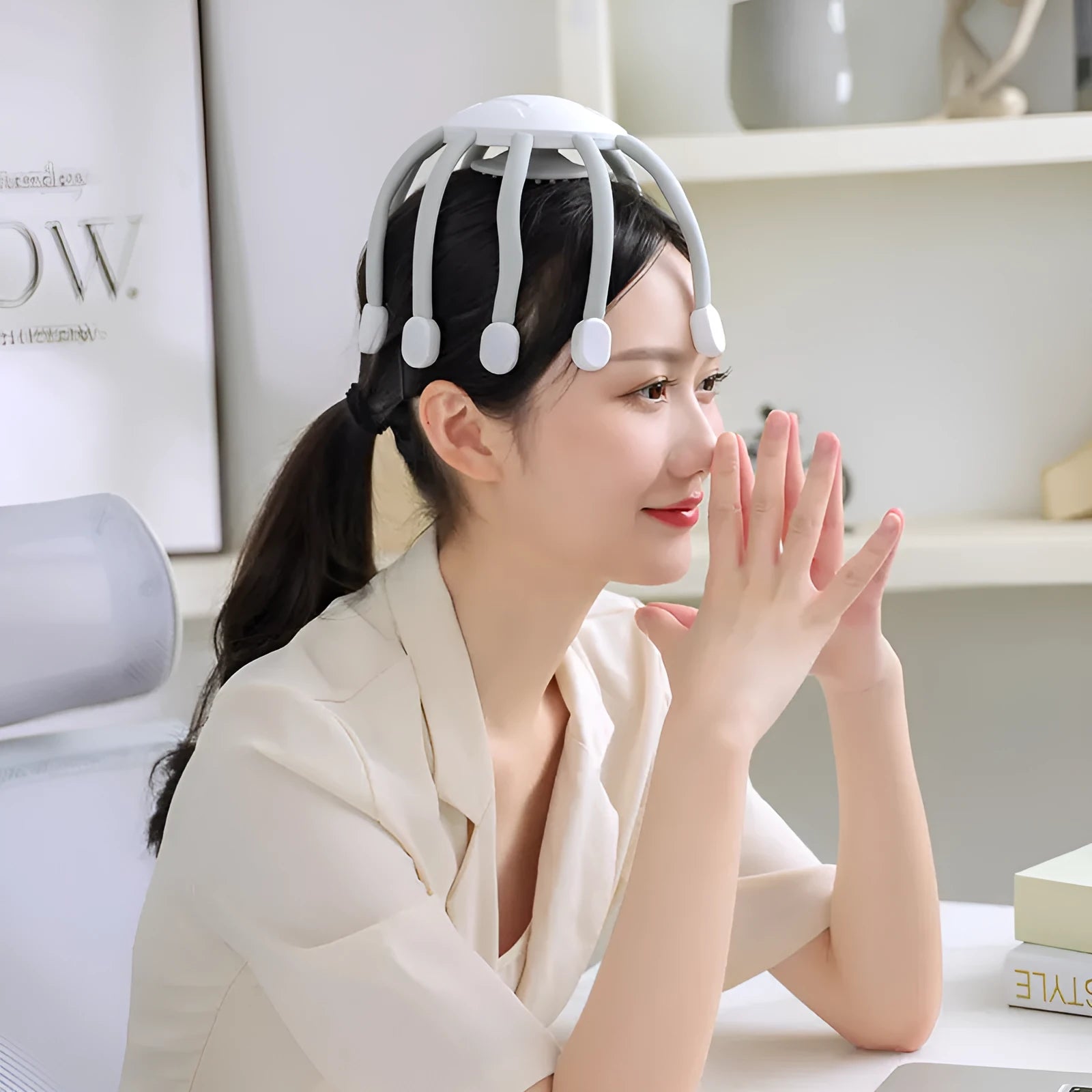 USB head massager with silicone claws showing black and white colour options