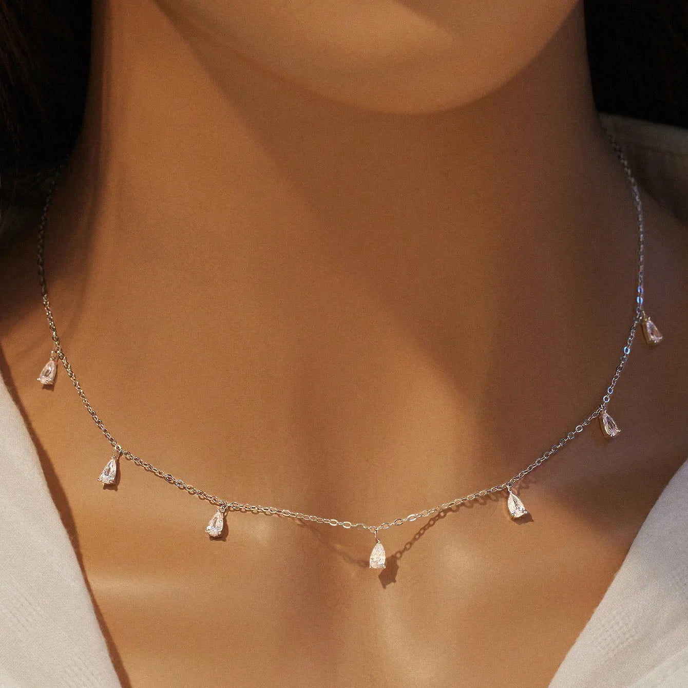 Women's 925 silver drop-shaped artificial zircon necklace on an adjustable O-chain, shown in silver finish.