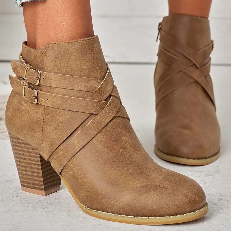 Plus size women's short ankle boots with a 7cm block heel, side zipper, and belt buckle detail in black.