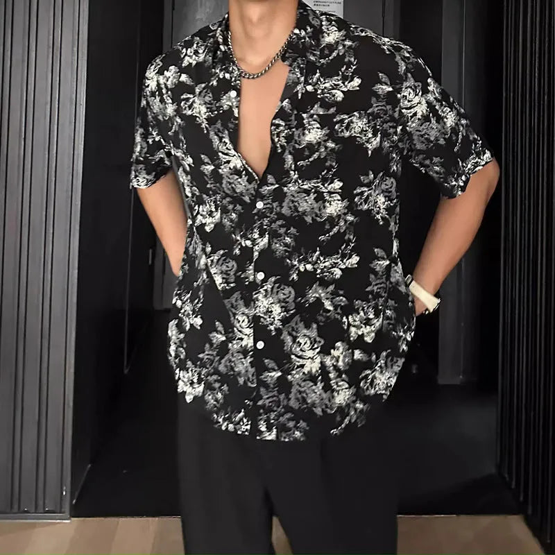 Man's loose-fit short sleeve shirt with printed floral pattern and pendant detail in black
