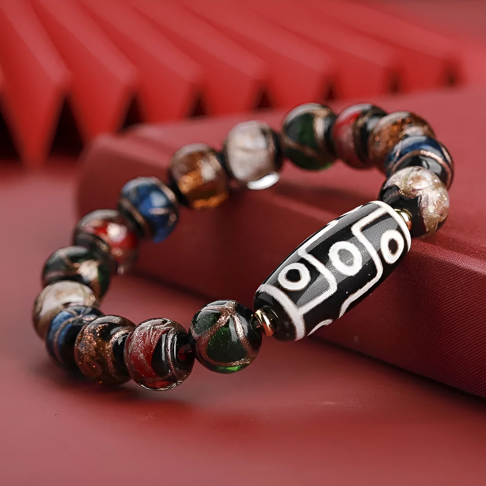 Chinese coloured glaze bracelet with snake beads in five-colour design, showing manual processing details