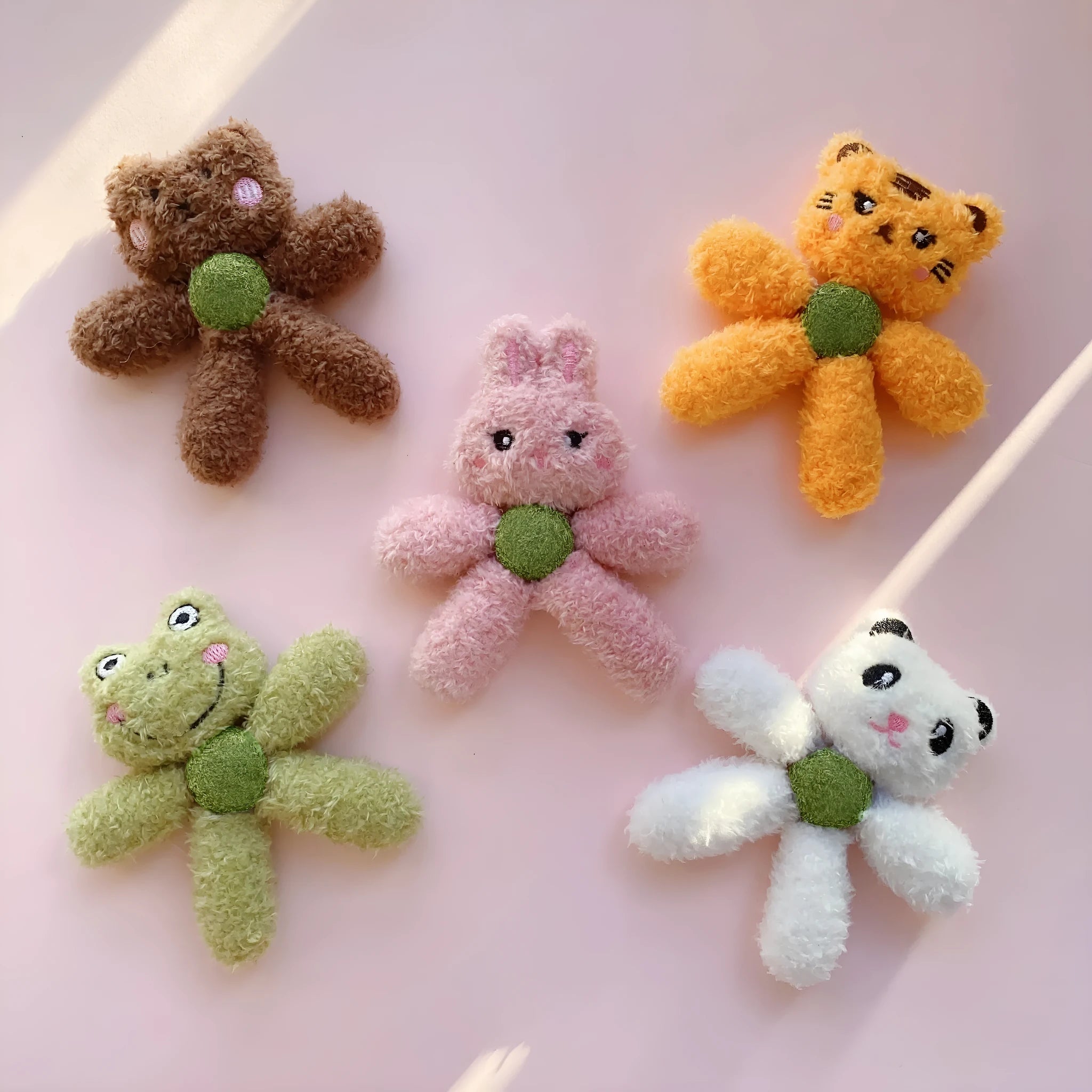 Brown bear shaped stuffed catnip ball edible chewing toy for cats on a white background.