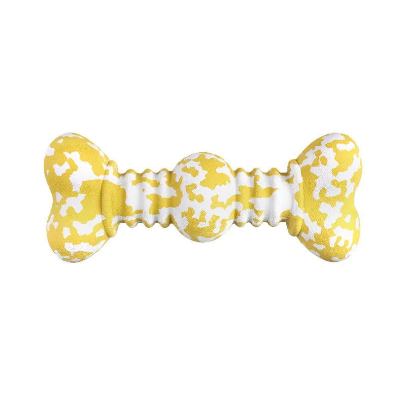 Green and white camouflage patterned natural rubber bone-shaped dog chew toy for large dogs on a wooden floor.