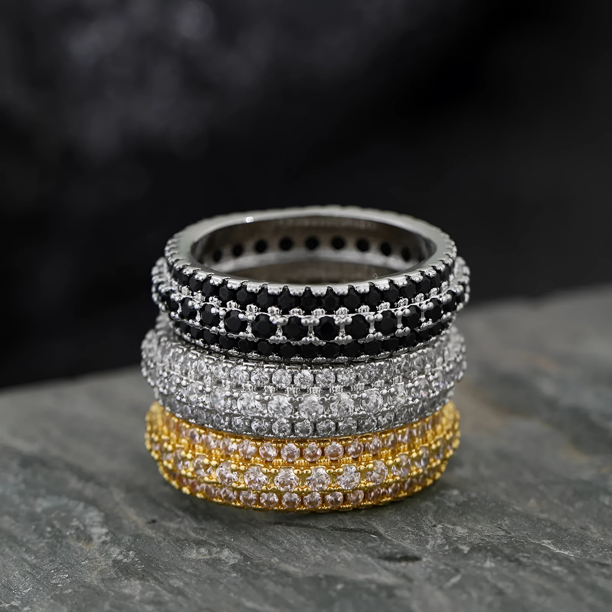 Geometric copper ring with a triangular zircon stone inlay, shown in a choice of colour finishes.